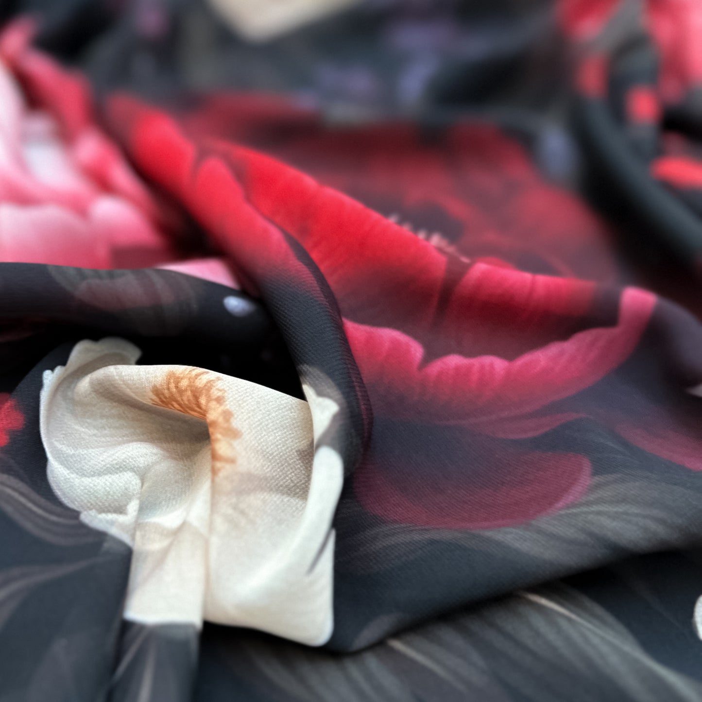 Peony Paradise – floral design on sheer chiffon fabric with large peonies in cream, blush, and deep red tones on a dark background, lightweight and airy texture, design by Sewing Club.